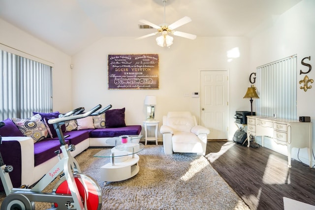 living room featuring hardwood / wood-style floors, vaulted ceiling, and ceiling fan