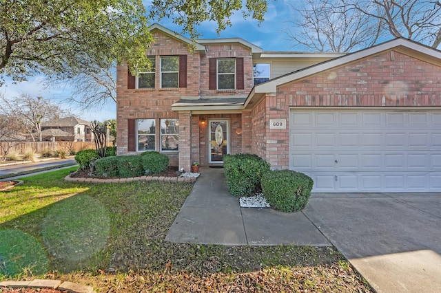 view of front of house with a garage and a front lawn