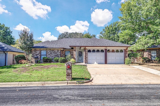 ranch-style house featuring a garage and a front yard