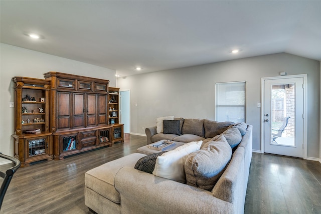 living room featuring dark hardwood / wood-style floors and lofted ceiling