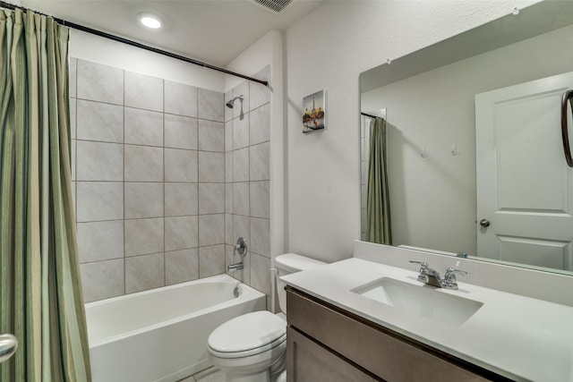 full bathroom featuring vanity, shower / bath combination with curtain, and toilet