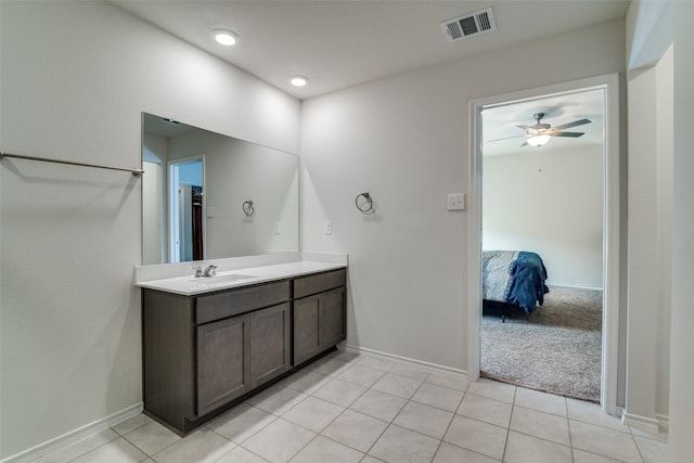 bathroom featuring tile patterned floors, ceiling fan, and vanity