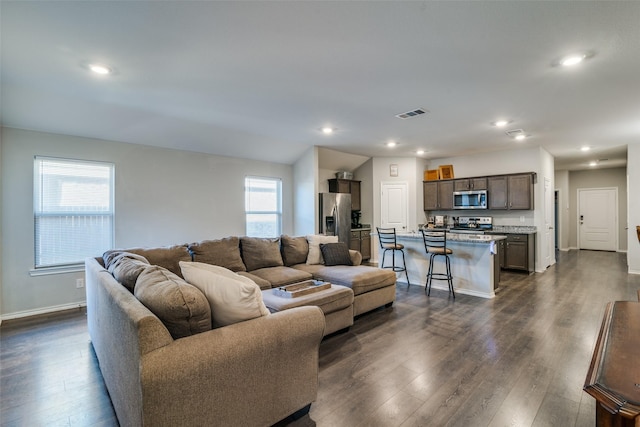 living room with dark wood-type flooring