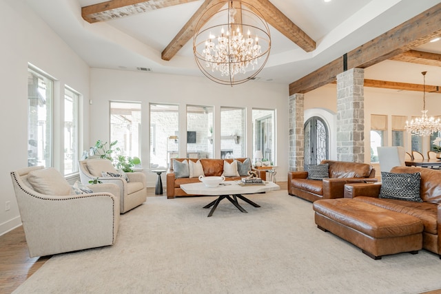 living room with hardwood / wood-style flooring and an inviting chandelier