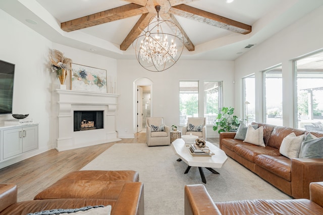 living room featuring an inviting chandelier and light wood-type flooring