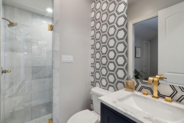 bathroom with vanity, toilet, and an enclosed shower