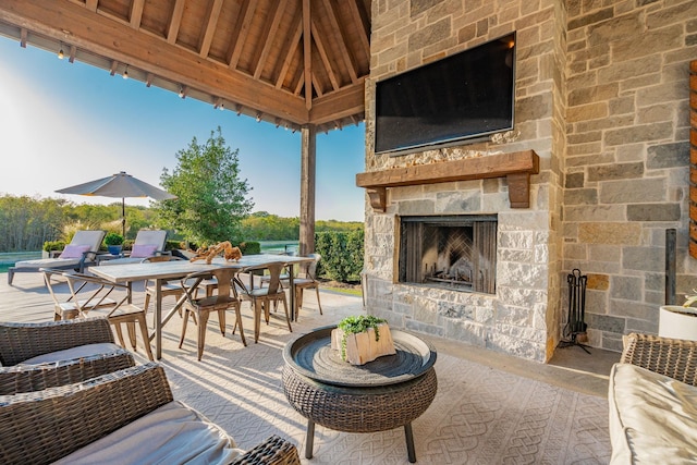 view of patio / terrace with an outdoor stone fireplace