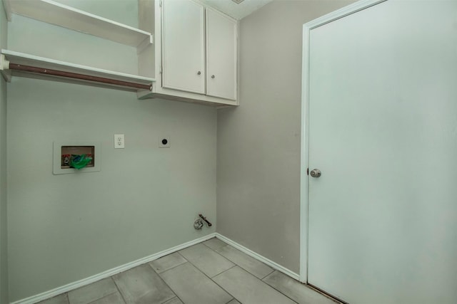 laundry room with cabinets, washer hookup, and hookup for an electric dryer