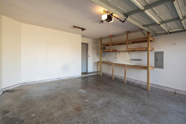 garage featuring a garage door opener and electric panel