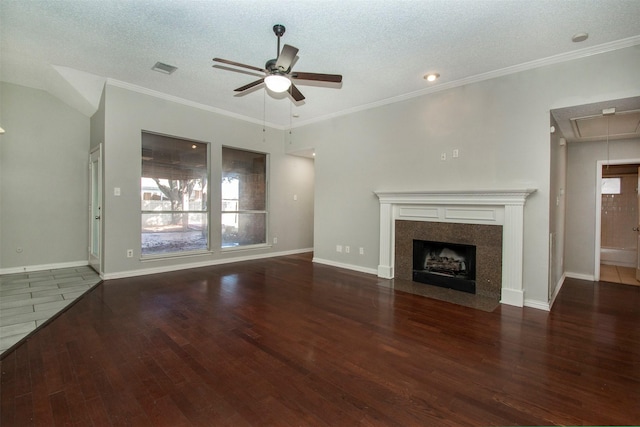 unfurnished living room with a textured ceiling, ornamental molding, dark hardwood / wood-style floors, and ceiling fan