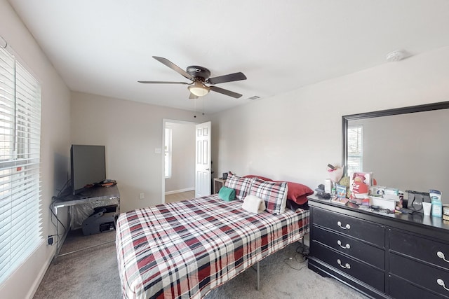 carpeted bedroom with ceiling fan