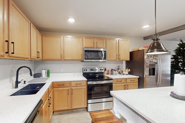 kitchen with stainless steel appliances, hanging light fixtures, sink, and light brown cabinets