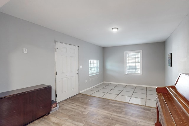 entryway with light hardwood / wood-style floors