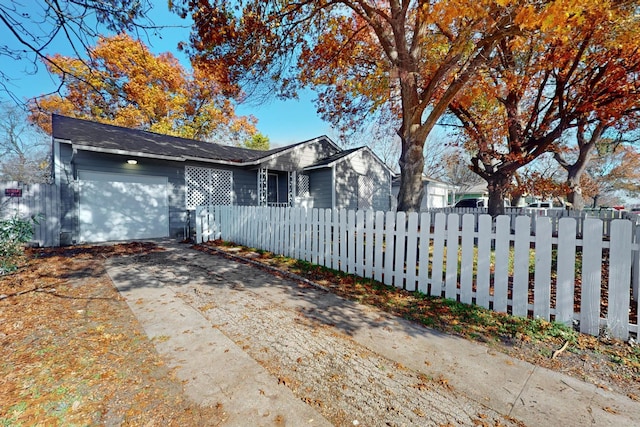 ranch-style house featuring a garage