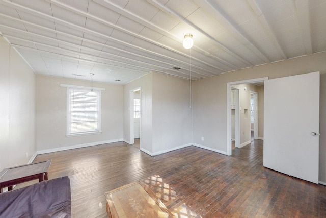 spare room with dark hardwood / wood-style floors