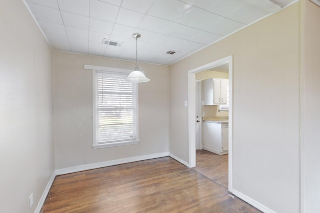 unfurnished dining area with hardwood / wood-style flooring