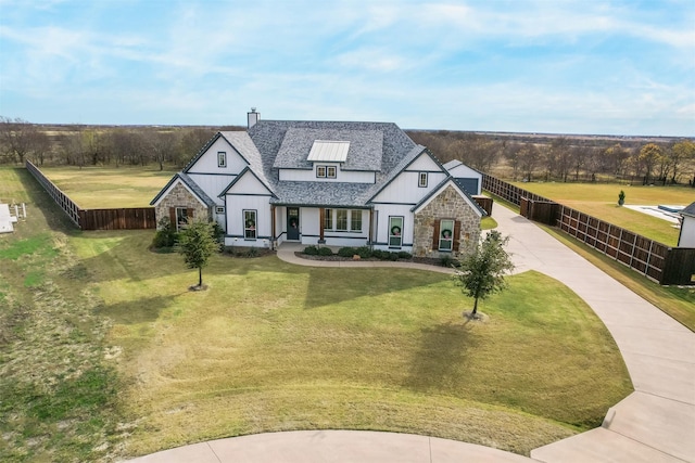 view of front of home featuring a front yard