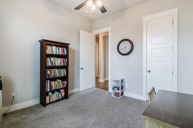 misc room with carpet flooring and ceiling fan