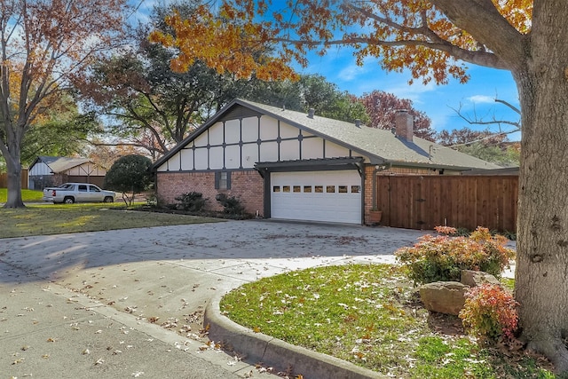 view of side of property with a garage