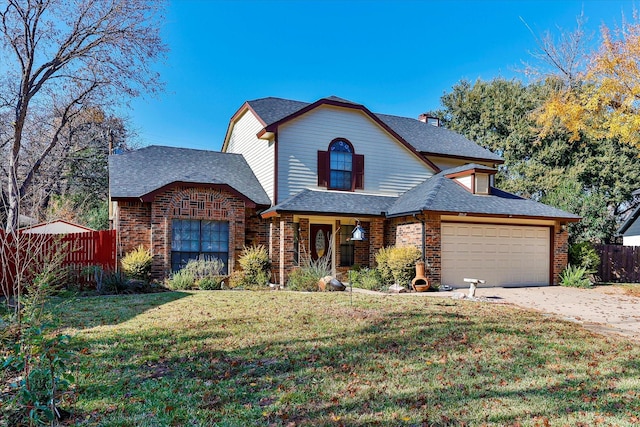 view of front property featuring a garage and a front yard