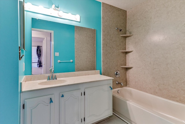 bathroom with tile patterned floors, vanity, and tiled shower / bath combo