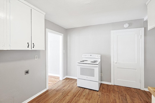 kitchen featuring electric range, light hardwood / wood-style flooring, and white cabinets