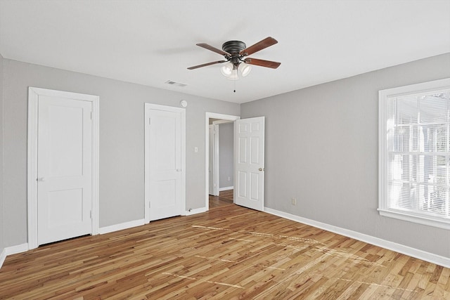 unfurnished bedroom featuring ceiling fan and light hardwood / wood-style floors