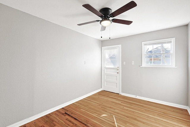 spare room with ceiling fan and light hardwood / wood-style floors