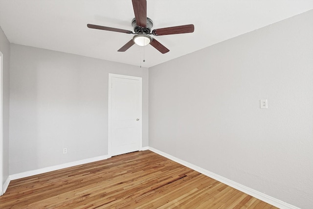 unfurnished room with hardwood / wood-style flooring and ceiling fan