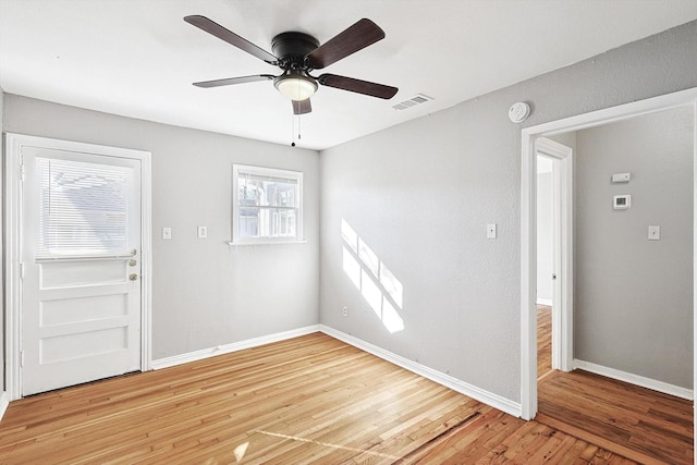 foyer with hardwood / wood-style flooring and ceiling fan