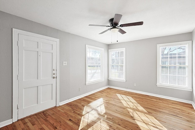 foyer featuring hardwood / wood-style flooring and ceiling fan