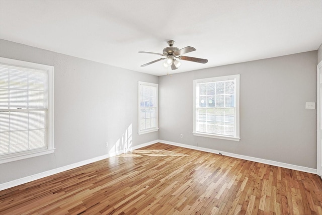 spare room featuring ceiling fan and light hardwood / wood-style flooring