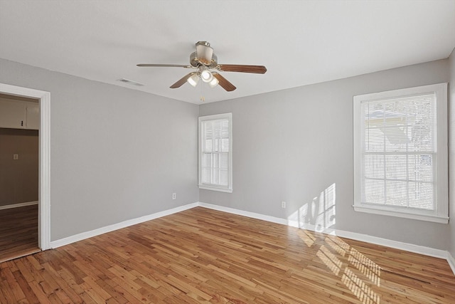 unfurnished room featuring hardwood / wood-style floors and ceiling fan