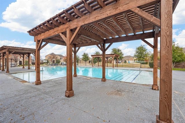 view of swimming pool featuring a pergola and a patio