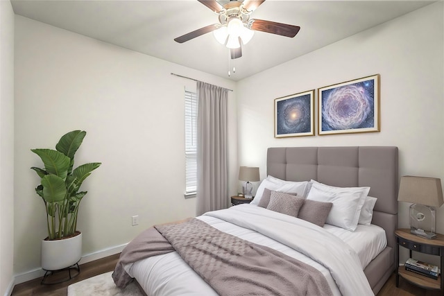 bedroom featuring ceiling fan and dark hardwood / wood-style flooring