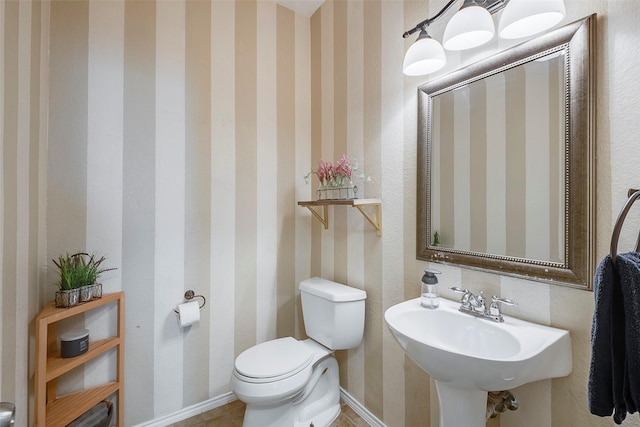 15404 Adlong Dr, Fort Worth, TX 76262 - half bathroom with toilet and wallpapered walls