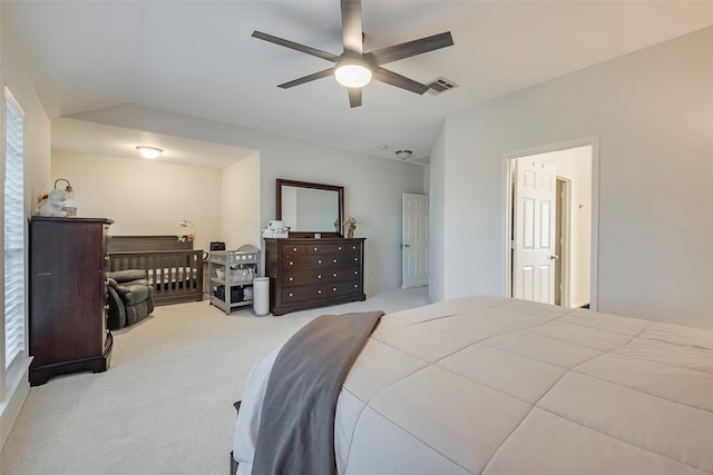 carpeted bedroom with lofted ceiling and ceiling fan