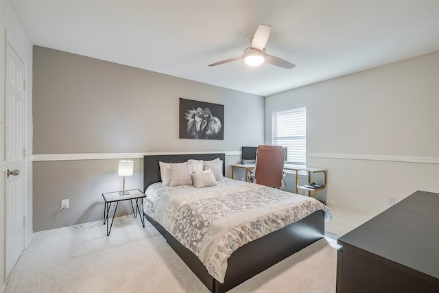 bedroom with light colored carpet and ceiling fan