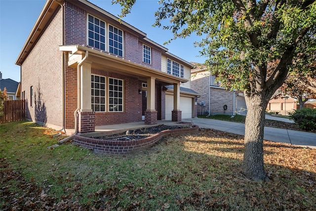 view of front of property with a front yard and covered porch