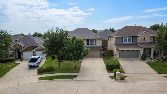 view of front facade with a garage and a front lawn