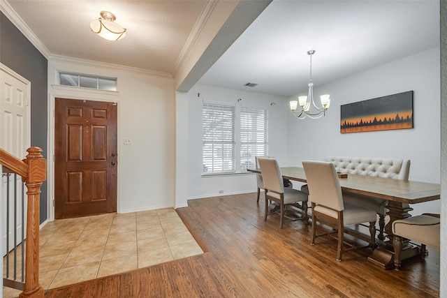 15404 Adlong Dr, Fort Worth, TX 76262 - entryway with a chandelier, wood finished floors, ornamental molding, and stairway