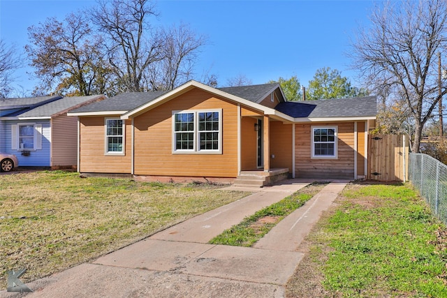 single story home featuring a front yard