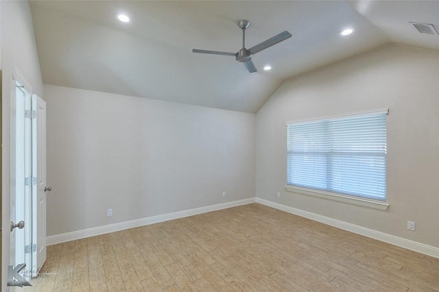 unfurnished room with ceiling fan, light hardwood / wood-style flooring, and vaulted ceiling