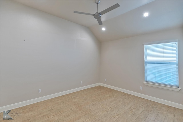 unfurnished room with light hardwood / wood-style floors, ceiling fan, and lofted ceiling