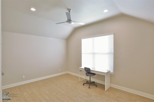 unfurnished office with ceiling fan, light hardwood / wood-style flooring, and lofted ceiling