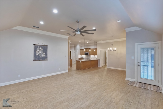 unfurnished living room with ceiling fan with notable chandelier, light hardwood / wood-style floors, and crown molding