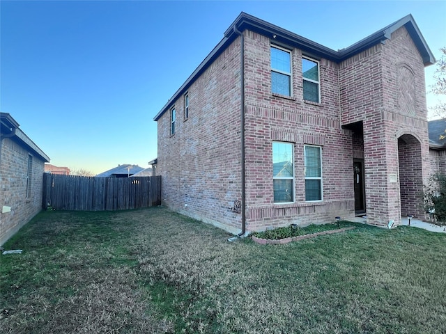 view of home's exterior with a yard