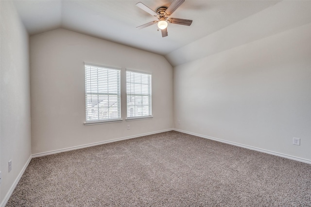 unfurnished room with carpet floors, vaulted ceiling, and ceiling fan