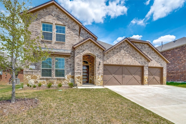 view of front of house featuring a front lawn and a garage