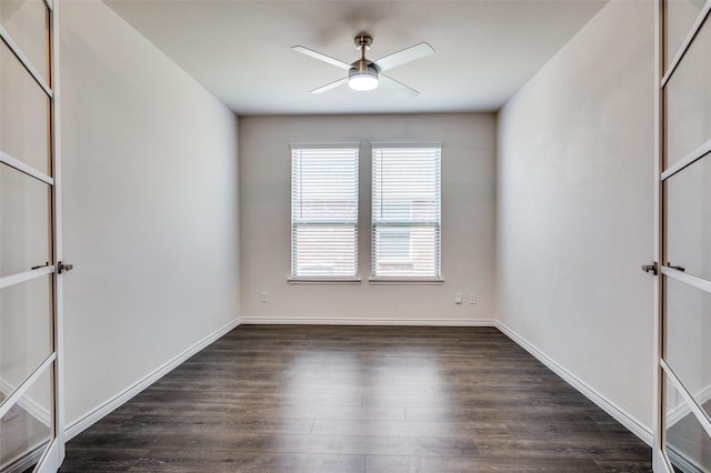 spare room featuring ceiling fan and dark hardwood / wood-style flooring